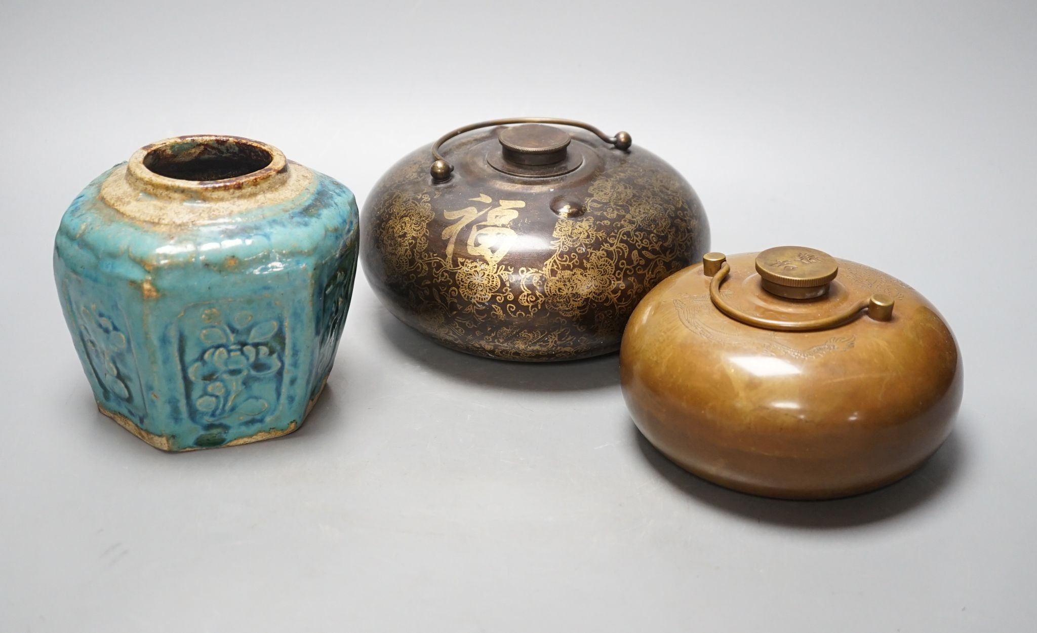 Two Chinese bronze handwarmers and a turquoise glazed jar